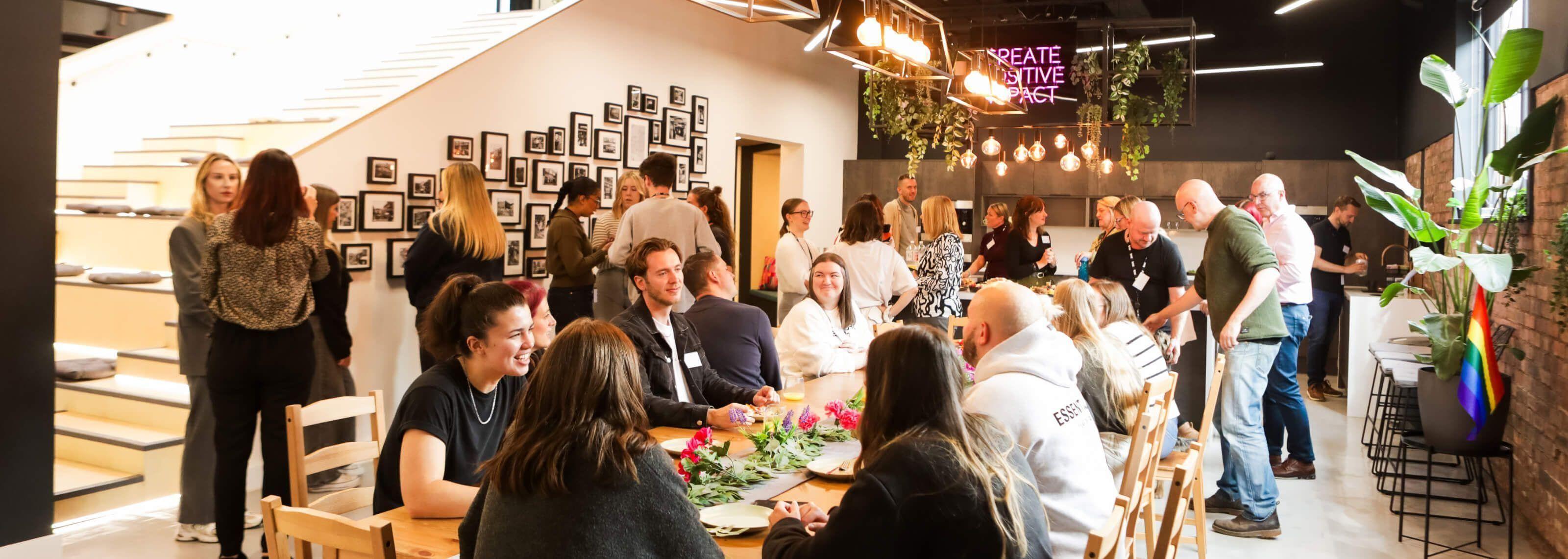 People networking around a table